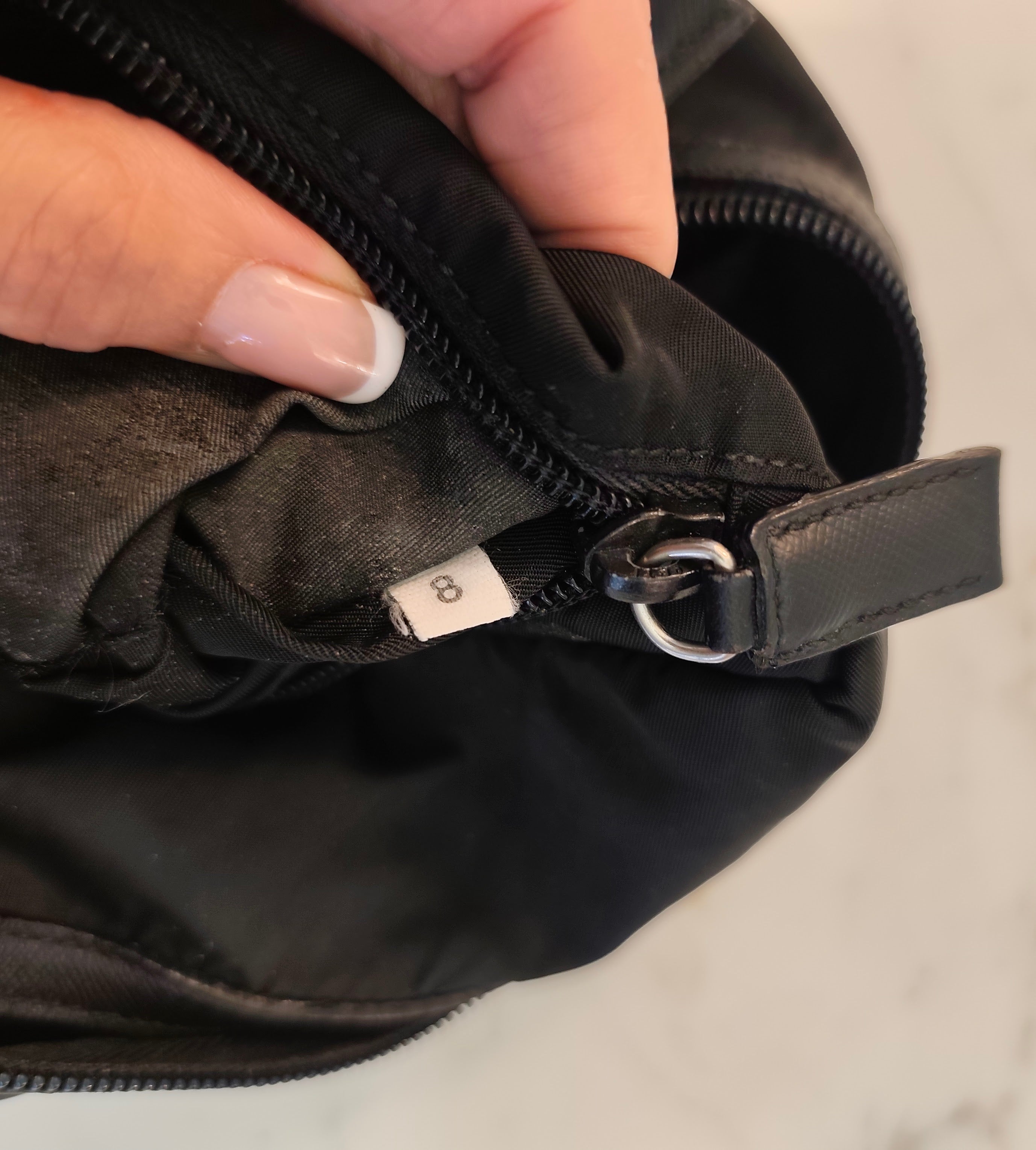 Prada – Trousse da Viaggio in Re-Nylon e Pelle Saffiano Nera